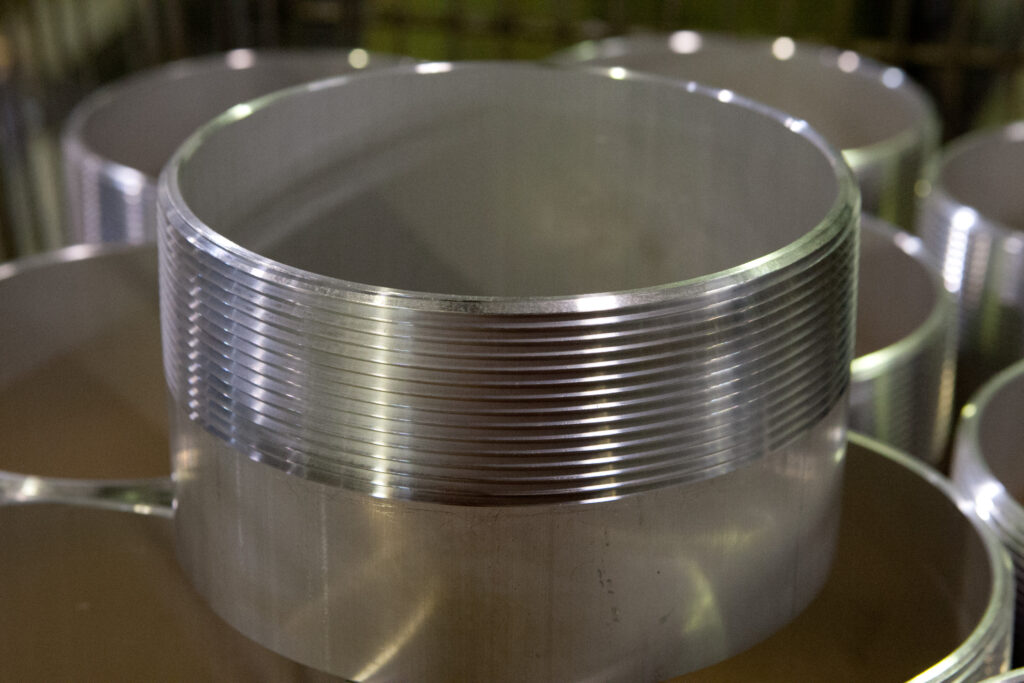 Aluminum cylinders with a threaded exteriors.